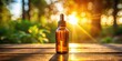 © Latsamee - Silhouette amber glass dropper bottle in sunlight on wooden surface