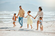 © peopleimages.com - Walking, holding hands and solidarity with family at beach for travel destination, summer or vacation. Relax, tropical and adventure with parents and children for holiday, bonding and happiness