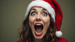 © fotoluigi868 - Woman in Santa hat has an extremely wide and noticeable opening of her mouth.