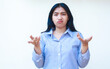 © M Alfan Setyawan - confused asian woman wearing casual stripes shirt pointing finger to empty space thinking choices standing over isolated white background