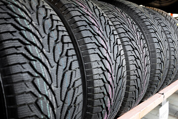 Winter car tire close up. Winter tire, friction for snow and ice. asymmetrical tread pattern