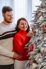 Wall Mural - couple together decorating christmas tree