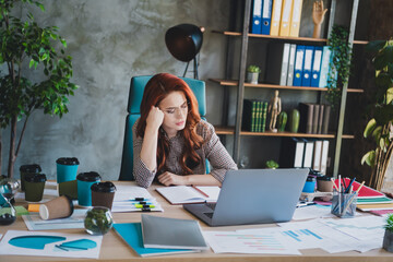 Photo of attractive stressed lady ceo dressed formal shirt feeling tired working modern gadget indoors workplace workstation loft