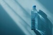 © Your Choice - Water bottle sitting on a blue surface with gentle shadows in soft lighting