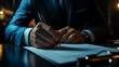 © milenialdesastudio - Close up of a businessman's hands signing a document.