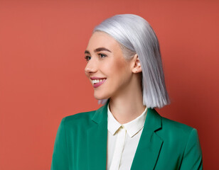 Wall Mural - Portrait of Beautiful Happy Young Woman Smiling Against Colorful Studio Background