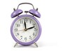 © Sergiu - Classic purple table alarm clock on a white background