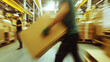 © Nakarin - Workers in warehouse are seen in motion, carrying large cardboard boxes, showcasing busy industrial environment filled with materials and activity