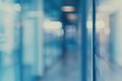 © ERiK - Blurred glass wall of modern business office building at the business center use for background in business concept.