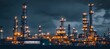© Liisa - A massive oil and gas intertwined industrial complex with towering towers, pipes, and tanks at night