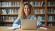 © Thierry - Young woman focused on work in a quiet library — A smiling young woman with curly hair working on her laptop in a library setting, surrounded by books.
