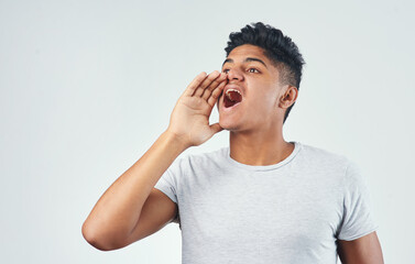 Studio, man and shouting for announcement, offer or attention for sales on white background. Indian person, loud yell and scream for communication, promotion information or advertising discount deal