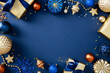 © photoguns - Luxury Christmas frame border with gold and blue ornaments on dark background. Perfect for holiday designs, greeting cards, and seasonal promotions