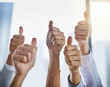 © peopleimages.com - Hands, business people and thumbs up for agreement, good job or success in collaboration, thank you or goals. Group, ok emoji and winning with yes, support or trust for teamwork or solidarity