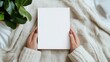 © AH TAR STOCK - Woman's hands open empty catalog, magazines, book mockup