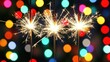 © Nuttaya Nampai - Colorful Sparklers with Blurred Lights in Background