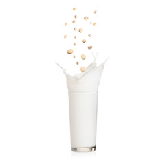 Sticker - Soy beans falling into glass of plant milk on white background