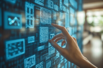 A hand reaching for a holographic computer screen with data and programming code