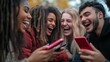 © Oulailux - A group of friends laughing together while sharing trendy memes on their phones