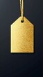© Mariya - Gold glitter tag with string on dark background with bokeh lights. Festive or holiday label design. Luxury or celebration concept. Design for greeting cards, gift wrapping and event invitation
