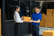 © NINENII - Asian delivery man deliver box parcel package to customer at home in the sun, shipping delivery concept.