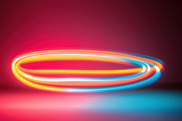 Colorful light trails create intricate pattern against dark background, showcasing vibrant hues of red, orange, and blue. dynamic movement evokes sense of energy and creativity