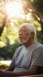 © Denisa - An elderly man reflects quietly while sitting on a bench in a sunlit park surrounded by trees