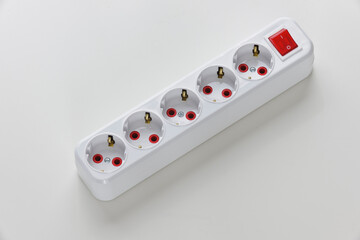 Electric white portable socket on white background