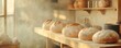 © Chayada - Rustic sourdough loaves cooling on wooden shelves in a cozy, old-fashioned bakery, surrounded by natural light