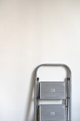 white background with ladder. Renovation apartment. repair and redecoration concept. copy space