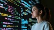 © Vladyslav Tykhonov - The integration of technology and human expertise in software development is presented by a young Asian woman programmer in front of an LCD screen with code projected