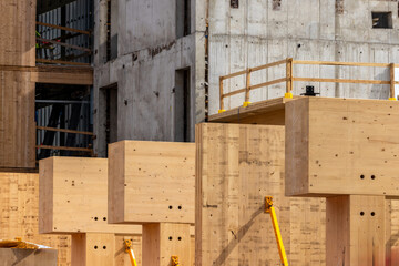 Glue laminated  mass timber beams and posts in a multi story green, sustainable, residential high rise or commercial office building construction project