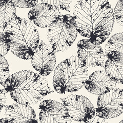 Seamless pattern with monochrome tree leaves stamps. Nature black and white grunge background. Floral inky repeat design.