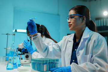 Wall Mural - team of scientists wearing lab coats, conducting research in a laboratory setting, analyzing test tu