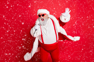 Wall Mural - portrait of cool funny fat overweight santa claus with big belly sing song on christmas party wear s