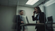 © Dmytriy - A businesswoman in a dark suit holding a phone in a modern office