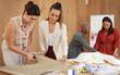 © peopleimages.com - Women, sewing teamwork and fashion work with collaboration, desk and style and studio. Clothing, production and creative planning with textile and fabric for manufacturing and designer agency