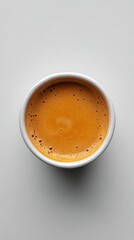 Sticker - A close up view of a steaming cup of coffee on a plain background in the morning light