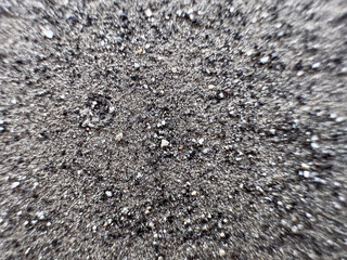 Defocused gray ash like sand from burning coal for background.