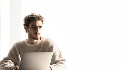 Poster - A young man focused on his laptop, engaged in remote work, surrounded by a minimalist white backdrop for inspiration. Generative AI