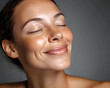 © Prasanth - Smile, eyes closed and skincare of mature woman in studio for glow, results or beauty on gray background. Face, happy and model in natural cosmetics for dermatology, anti aging and aesthetic at spa