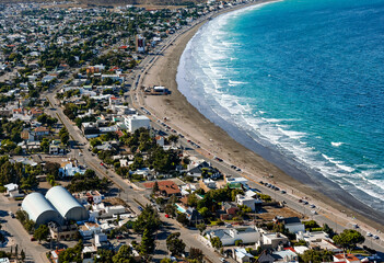 Landscape with a beautiful view of Rada Tilly, a coastal town in Chubut Province, Argentina with a beach, houses, cliffs and copy space. Rada Tilly is the Southernmost Beach Resort In South America