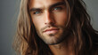 © Alexander - Man with a beard and long hair is smiling. He has a light brown hair and a light brown beard