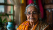 © Creator - Portrait of an elderly Indian woman with a calm and wise expression, wearing traditional attire. Her glasses and soft smile add to the serene and respectful ambiance of the image.