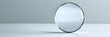 © lena - sleek and circular glass lens reflecting light against a clean and minimalistic background
