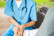 © ADDICTIVE STOCK - Nurse student comforting patient in outdoor setting