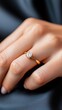 © LifeMedia - A close-up view of a hand wearing a beautiful, sparkling diamond engagement ring on the finger, showcasing elegance and style against a soft background.