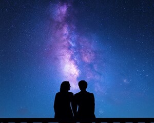 Canvas Print - Silhouette of a couple gazing at a starry night sky with the Milky Way.