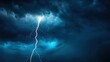 © Thamonchanok - Lightning striking through dark storm clouds in a dramatic evening sky.