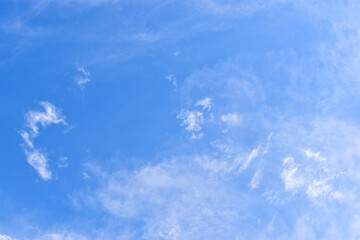 Wall Mural - beautiful blue sky and white fluffy group of clouds with sunrise in the morning, natural background